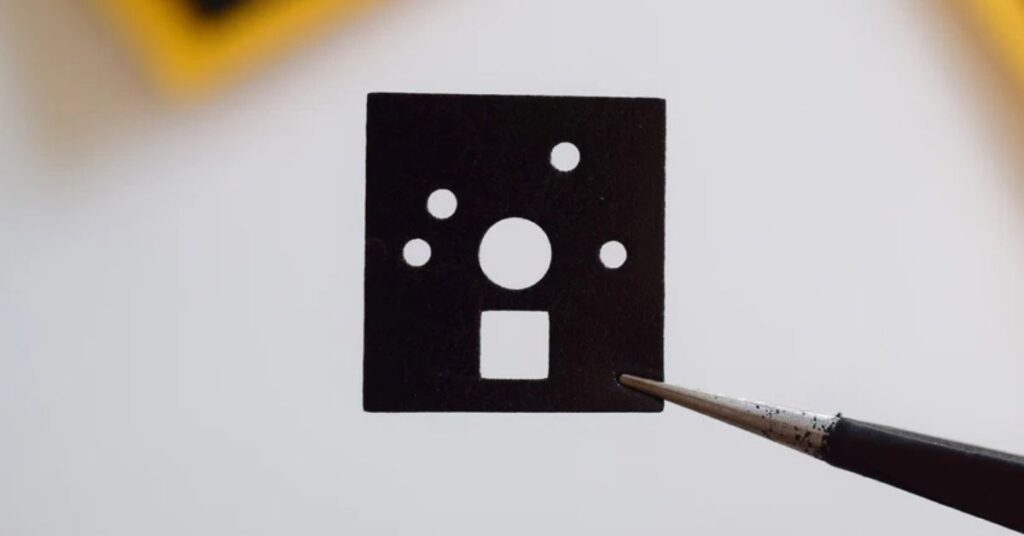 Close up of IPXE Pad held by a tweezer