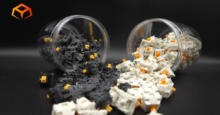 Close up shot of Drop Holy Panda X and Glorious Panda switches spilling from jars