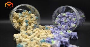 Close up shot of EPOMAKER Budgerigar and EPOMAKER Wisteria switches spilling from jars