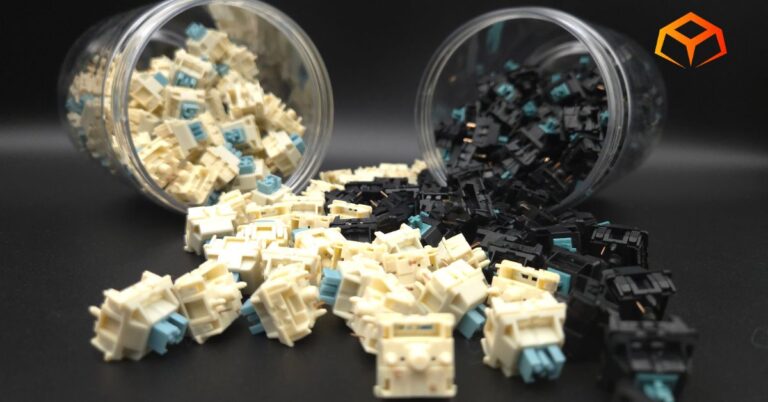 Close up of EPOMAKER Budgerigar and JWICK Black T1 switches spilling from jars