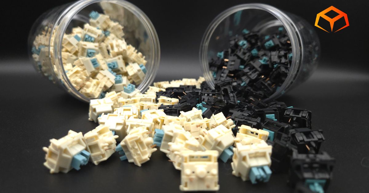 Close up of EPOMAKER Budgerigar and JWICK Black T1 switches spilling from jars