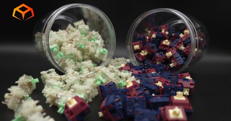 Close up of Gateron Baby Kangaroo and Gateron Quinn switches spilling from jars