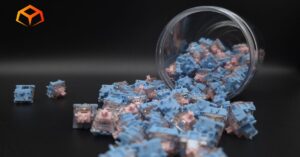 Close up shot of Gateron Melodic switches spilling from a jar