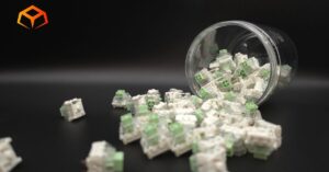 Close up shot of Kailh Box Jade switches spilling from a jar