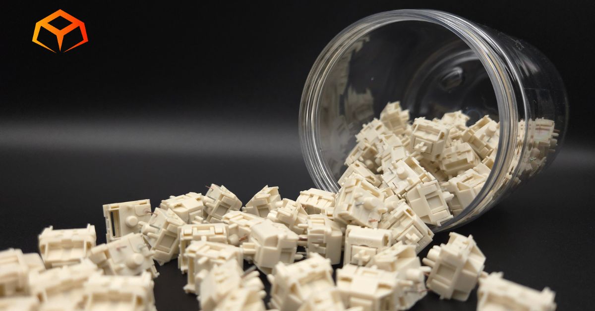 Close up shot of NovelKeys Cream switches spilling from a jar