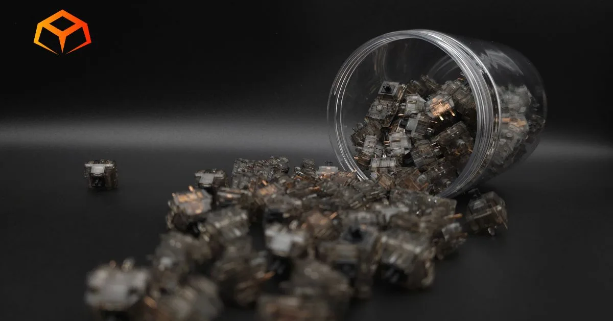 Close up shot of Gateron Ink Black switches spilling from a jar