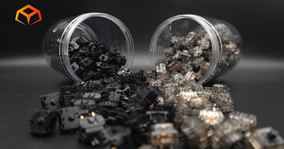 Close up shot of Gateron Oil King and Gateron Ink Black switches spilling out of jars