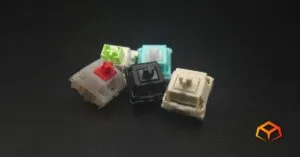 Macro shot of a single Gateron Oil King, Gateron Cream Soda, LEOBOG Reaper, Glorious Lynx, and NovelKeys Cream switches clumped together in the middle of the photo